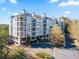 Elegant multi-story building with balconies, showcasing modern architectural design and ample parking at 4100 Paces Se Walk # 4306, Atlanta, GA 30339