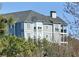 Charming light blue house with gray roof, complemented by well-placed windows and a picturesque view at 4100 Paces Se Walk # 4306, Atlanta, GA 30339