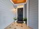 Charming entrance featuring a stylish black door, tiled floor, and lovely planters at 4100 Paces Se Walk # 4306, Atlanta, GA 30339