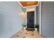 Charming front door with sidelight, accent plants, and decorative tile flooring at 4100 Paces Se Walk # 4306, Atlanta, GA 30339