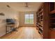 Inviting home office featuring hardwood floors, a bookcase, and a large window for natural light at 4100 Paces Se Walk # 4306, Atlanta, GA 30339