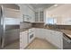 An eat-in kitchen has stainless appliances, granite countertops, and white cabinetry at 4100 Paces Se Walk # 4306, Atlanta, GA 30339