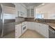 Updated kitchen featuring white cabinets, granite countertops, and stainless steel appliances at 4100 Paces Se Walk # 4306, Atlanta, GA 30339