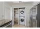 A convenient laundry room with stacked washer/dryer units and shelving at 4100 Paces Se Walk # 4306, Atlanta, GA 30339