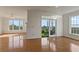 Spacious living room with hardwood floors, fireplace, and access to an outdoor balcony at 4100 Paces Se Walk # 4306, Atlanta, GA 30339