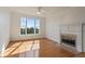 Bright living room featuring a fireplace and large window offering scenic views at 4100 Paces Se Walk # 4306, Atlanta, GA 30339