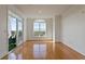 Open living area featuring hardwood floors, modern chandelier, and sliding door to outdoor patio at 4100 Paces Se Walk # 4306, Atlanta, GA 30339