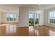Open living space featuring hardwood floors, fireplace, and access to a balcony with seating at 4100 Paces Se Walk # 4306, Atlanta, GA 30339