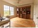 A well-lit office features a built-in bookcase and hardwood floors at 4100 Paces Se Walk # 4306, Atlanta, GA 30339