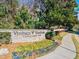 Community entrance sign for Vinings Vineyard Condominiums with colorful landscaping, adding to street appeal at 4100 Paces Se Walk # 4306, Atlanta, GA 30339
