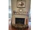 Cozy fireplace with a unique hearth and mantel decorations create a warm ambiance at 4173 Stillwater Dr, Duluth, GA 30096