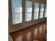 Light filled sunroom with multiple bright windows and hardwood floors at 4173 Stillwater Dr, Duluth, GA 30096
