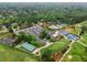 Beautiful aerial view of a golf course community with tennis courts, parking, and mature trees at 575 Indian Hills Pkwy, Marietta, GA 30068