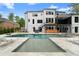 Stunning backyard with a large swimming pool, sun loungers, outdoor bar, and beautifully landscaped surroundings at 575 Indian Hills Pkwy, Marietta, GA 30068