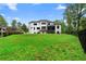 Expansive backyard featuring a well-maintained lawn and modern home design, perfect for outdoor activities and relaxation at 575 Indian Hills Pkwy, Marietta, GA 30068