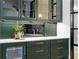 Close up of the wet bar area featuring dark green cabinets with gold hardware and beverage cooler at 575 Indian Hills Pkwy, Marietta, GA 30068
