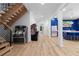 Finished basement featuring an open layout with games and wet bar with refrigerator and sink at 575 Indian Hills Pkwy, Marietta, GA 30068