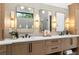Luxurious bathroom with a double vanity, modern fixtures, warm lighting, and ample counter space for storage at 575 Indian Hills Pkwy, Marietta, GA 30068