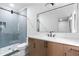 Modern bathroom with glass shower, sleek vanity, and unique tile work at 575 Indian Hills Pkwy, Marietta, GA 30068