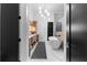 Bright bathroom features a freestanding tub, double vanity, elegant lighting, and marble floors at 575 Indian Hills Pkwy, Marietta, GA 30068