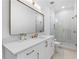 Bathroom featuring vanity with quartz countertops, framed mirror, and walk-in shower at 575 Indian Hills Pkwy, Marietta, GA 30068