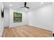 Bedroom featuring hardwood floors, neutral paint, lots of natural light, and modern ceiling fan at 575 Indian Hills Pkwy, Marietta, GA 30068