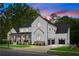 Beautiful two-story modern farmhouse with a manicured lawn and three-car garage at 575 Indian Hills Pkwy, Marietta, GA 30068