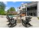 Outdoor fire pit area surrounded by comfortable seating, creating a cozy gathering spot in the backyard at 575 Indian Hills Pkwy, Marietta, GA 30068
