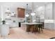 Bright, open kitchen with white cabinets, a large island and stainless steel appliances at 575 Indian Hills Pkwy, Marietta, GA 30068