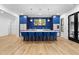 Open kitchen featuring a large island with seating, wood floors, and pendant lighting at 575 Indian Hills Pkwy, Marietta, GA 30068