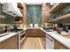 Galley kitchen featuring wood cabinetry, stainless steel appliances and unique vertically stacked tile backsplash at 575 Indian Hills Pkwy, Marietta, GA 30068