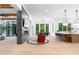Open floor plan with modern fireplace, tv, kitchen, and dining area at 575 Indian Hills Pkwy, Marietta, GA 30068