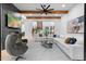 Bright and open living room with fireplace, tv, stairs, and kitchen view at 575 Indian Hills Pkwy, Marietta, GA 30068