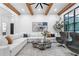 Spacious living room with beamed ceiling, open concept, and large sectional sofa at 575 Indian Hills Pkwy, Marietta, GA 30068