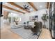 Bright living room with wood beams, plush seating, and view to the staircase at 575 Indian Hills Pkwy, Marietta, GA 30068