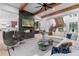 Bright and open living room with fireplace, tv, stairs, and kitchen view at 575 Indian Hills Pkwy, Marietta, GA 30068