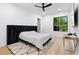 Bedroom featuring hardwood floors, neutral paint, area rug, and lots of natural light at 575 Indian Hills Pkwy, Marietta, GA 30068