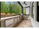 Gourmet outdoor kitchen with stainless steel grill, built-in refrigerator, and stone countertop for easy meal prep at 575 Indian Hills Pkwy, Marietta, GA 30068