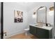Chic powder room features a marble countertop, gold fixtures, and decorative sconces at 575 Indian Hills Pkwy, Marietta, GA 30068