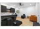 Salon featuring hardwood floors, modern cabinets and sink, salon chair, and comfortable seating at 575 Indian Hills Pkwy, Marietta, GA 30068