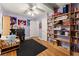 Comfortable bedroom with custom bookshelves and ample natural light at 5855 Willis Ln, Cumming, GA 30040