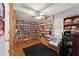 Cozy bedroom with custom bookshelves and a ceiling fan at 5855 Willis Ln, Cumming, GA 30040