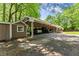 Spacious carport offering covered parking and storage solutions, connecting to the main house at 5855 Willis Ln, Cumming, GA 30040