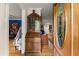 Inviting entryway with hardwood floors, decorative accents, and a glimpse into the home's interior at 5855 Willis Ln, Cumming, GA 30040