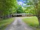 Ranch home with driveway and covered parking at 5855 Willis Ln, Cumming, GA 30040