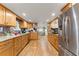 Bright and airy kitchen featuring stainless steel appliances, wooden cabinets, and a breakfast nook at 5855 Willis Ln, Cumming, GA 30040