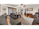 Cozy living room featuring comfortable seating, hardwood floors, and lots of natural light at 5855 Willis Ln, Cumming, GA 30040