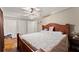 Inviting main bedroom featuring a ceiling fan, closet and ample space at 5855 Willis Ln, Cumming, GA 30040