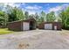 This area of the lot shows large metal buildings perfect for storage or a shop at 5855 Willis Ln, Cumming, GA 30040