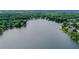 An aerial view of the lake and surrounding neighborhood with mature trees at 1215 Wynridge Xing, Alpharetta, GA 30005